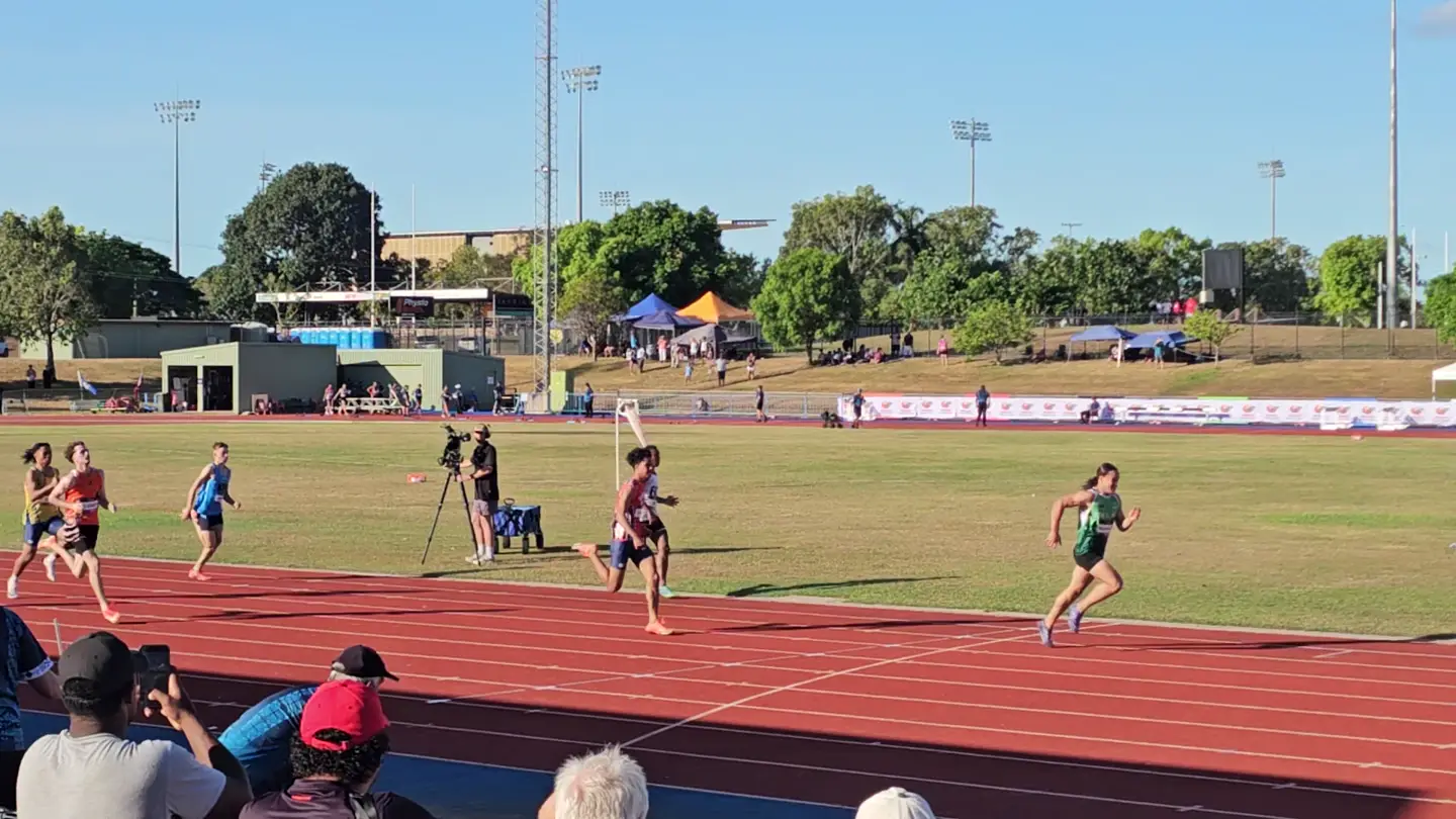 Vernie in the green Cook Islands singlet running clear of the field in the Oceania U16 200m final
